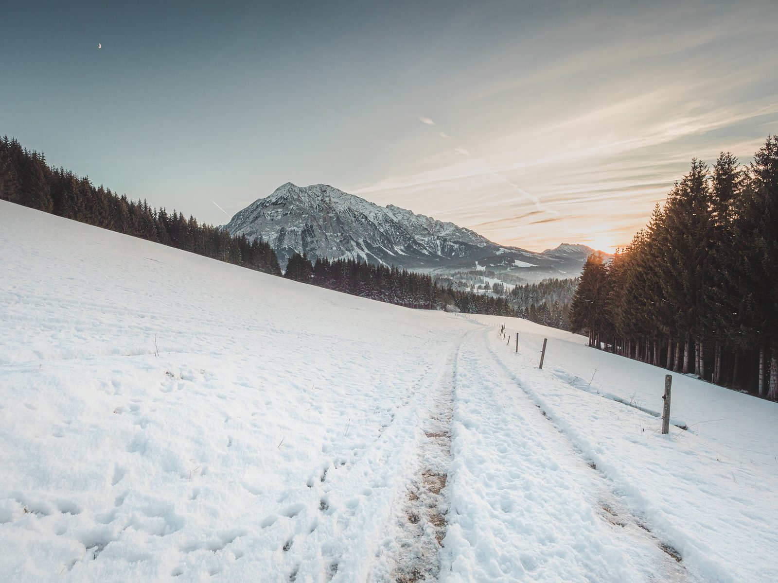 Snow-covered alpine landscape at sunset near Tauplitz